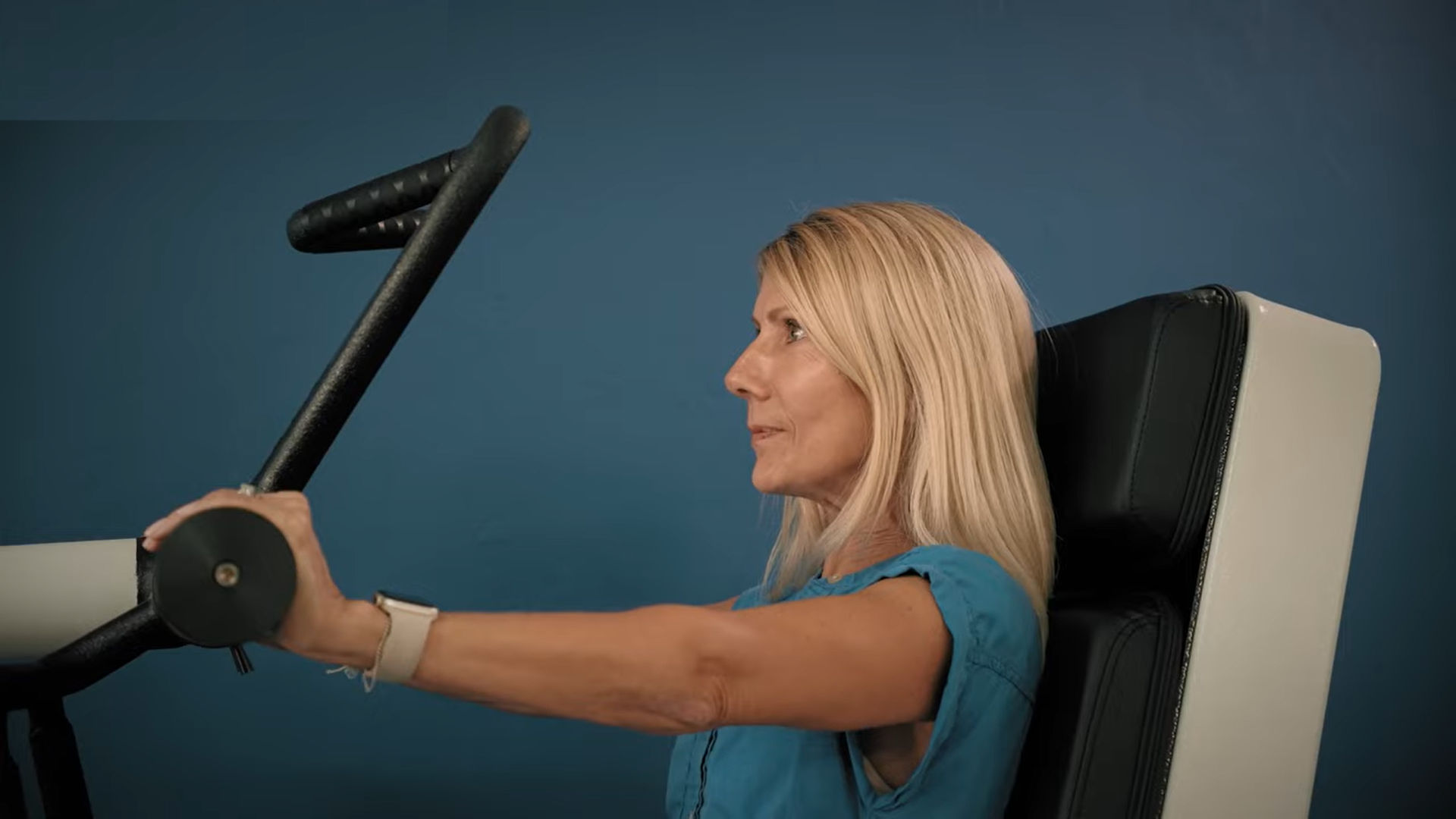 Woman in her 40s or 50s performing bioDensity Chest Press