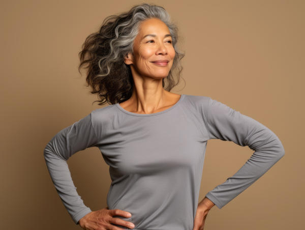 50 year old Asian woman in emotional-pose