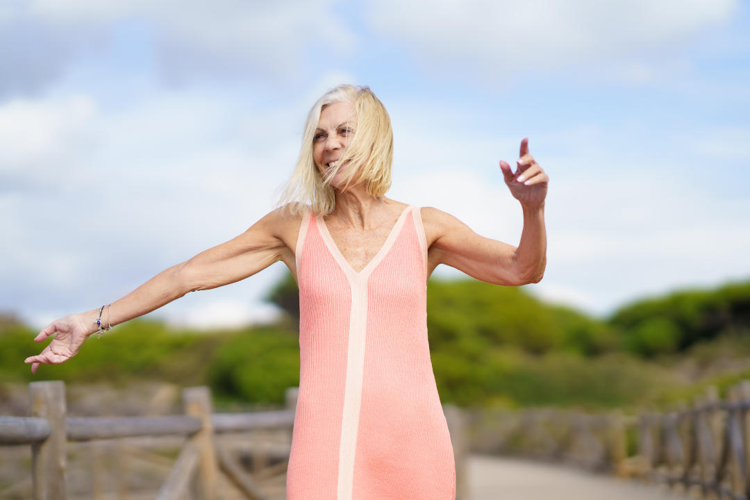 mature Powell woman walking along a wooden path